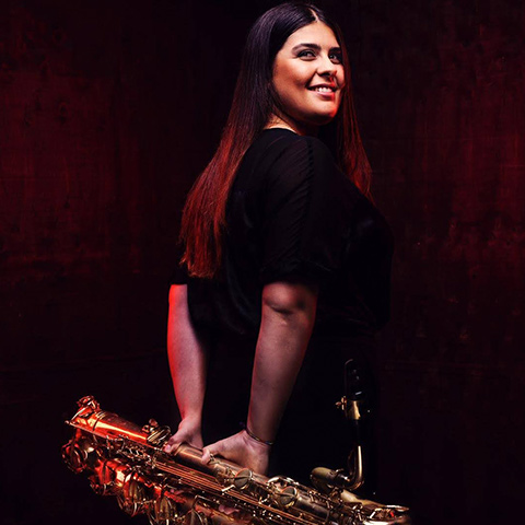 Alicia holding saxophone