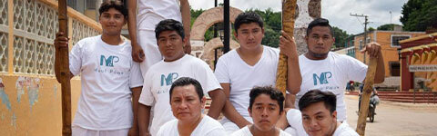 the members of a Mayan hip-hop collective posing for a photo