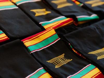 Kente cloths on table for Jabulani celebration