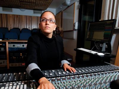 Woman working at a large mixing board