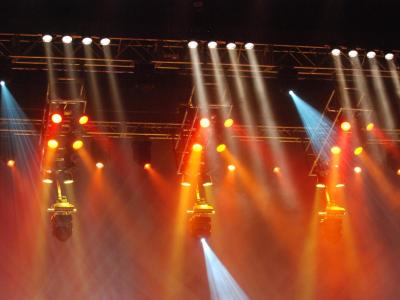 Professional stage lighting equipment with orange and blue colored lights