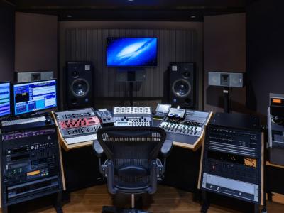 Interior of professional music production studio with advanced hardware and software
