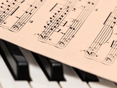 Sheet music on top of piano keys