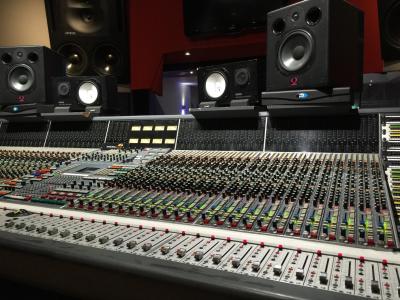 Large sound mixing console with other professional equipment
