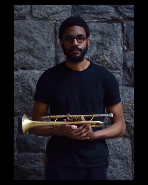 Jonathan Shillingford holding a trumpet 