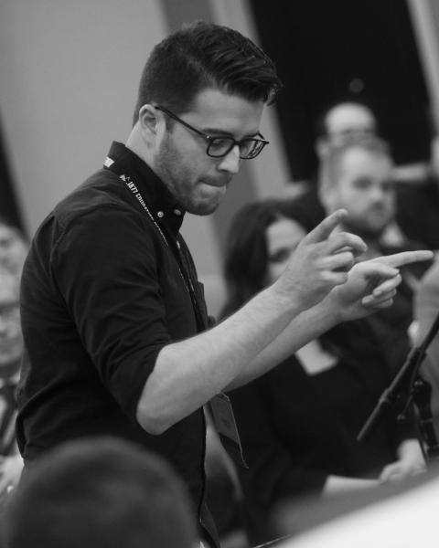 Ryan Goss directing musicians 