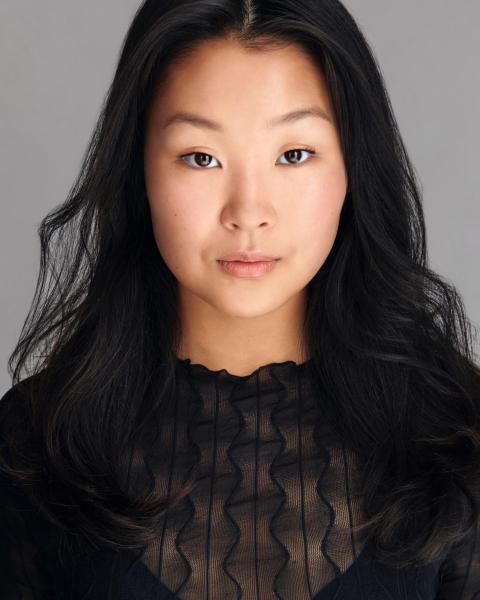 Vocalist and actor Charlotte Um poses for headshot.