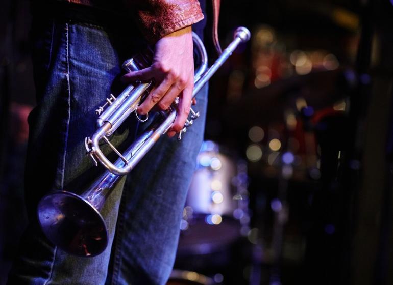 A musician holding a trumpet 