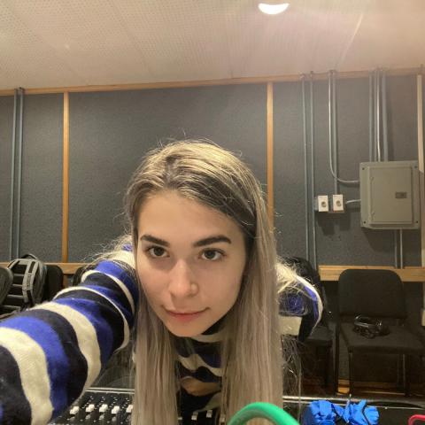 Riley Finkle taking a selfie in a Berklee studio control room