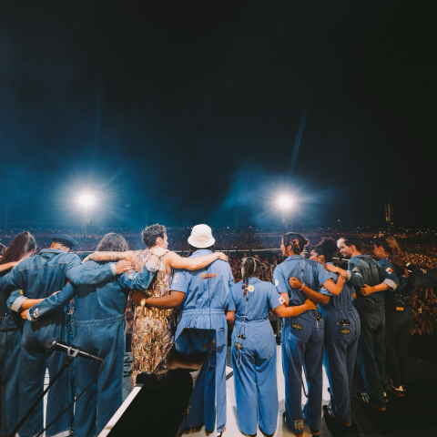 Trumpeter Laura Bibbs (fifth from right) joins Harry Styles and the rest of his band, as they take a bow on stage at the RFC Arena in Reggio Emilia, Italy. 