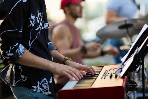 Keyboardist at outdoor concert