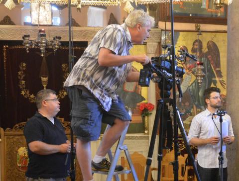 James Donahue working a video camera in a Byzantine cathedral 