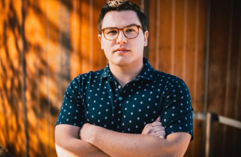 Headshot of Eric Ferring crossing his arms