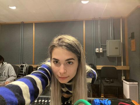 Riley Finkle taking a selfie in a Berklee studio control room