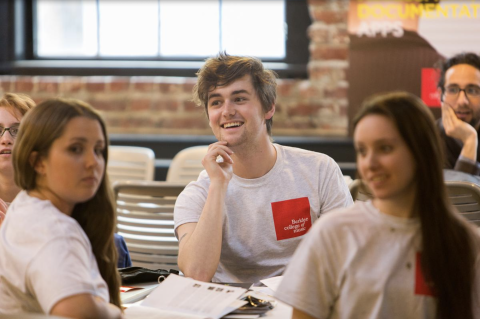A photo of a student at a table. 