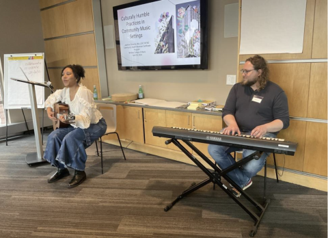 A photo of people playing instruments. 