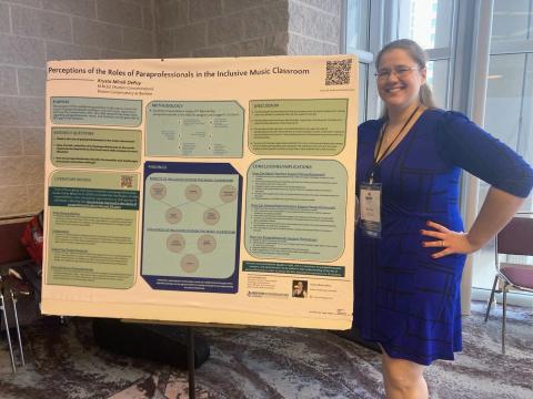 Krysta Mirsik DePuy poses with her thesis.