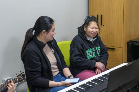 Wendy Feng and a music therapy client.