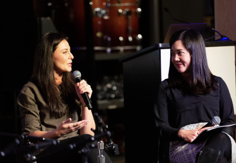 People speaking on a panel.